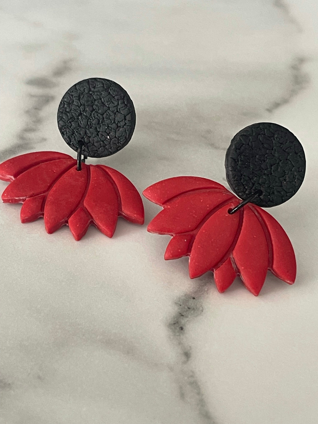 Red clip-on earrings